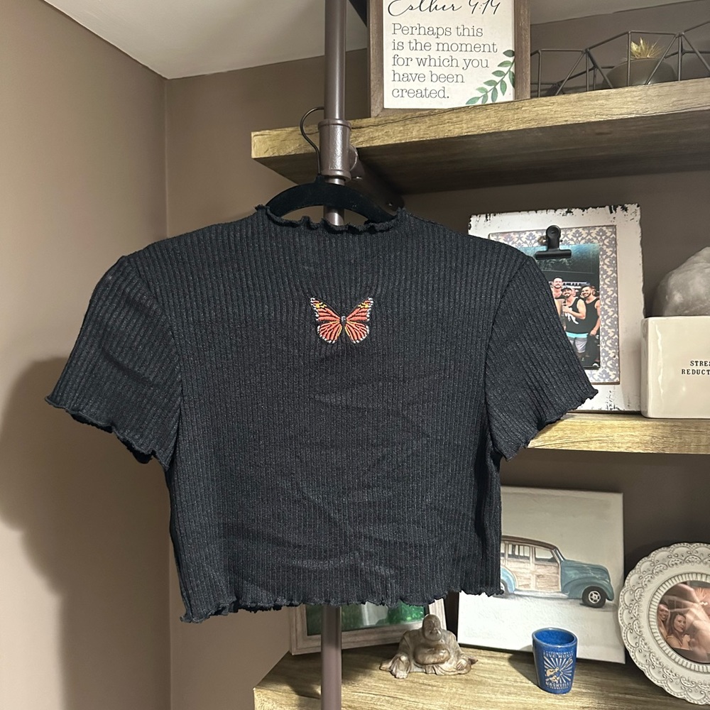 Black top with butterfly stitch! Worn once! Size large but fits like medium!